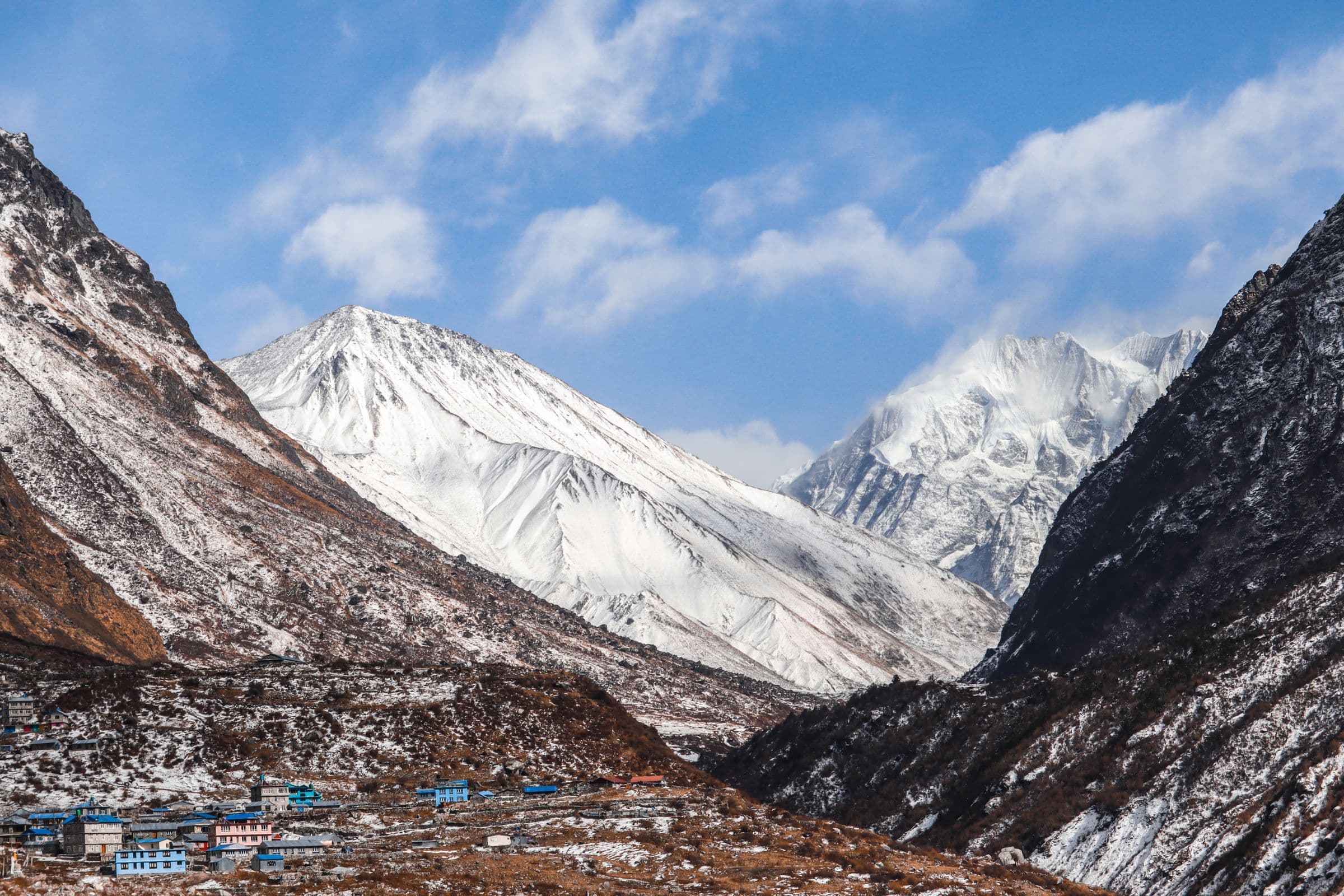 Majestic view of snow-covered peaks in Bagmati Province, Nepal, under a clear blue sky.