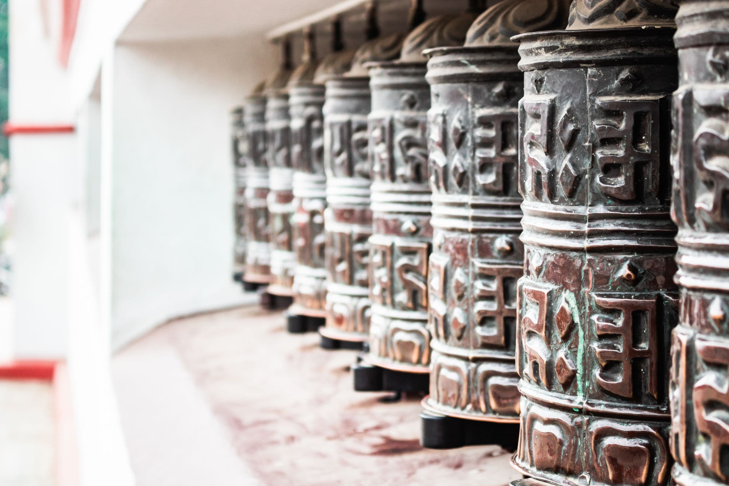Close-up of traditional Buddhist prayer wheels in Kathmandu, Nepal.